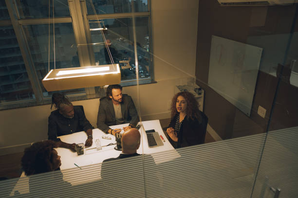 istock Coworkers talking at the table 1444565065