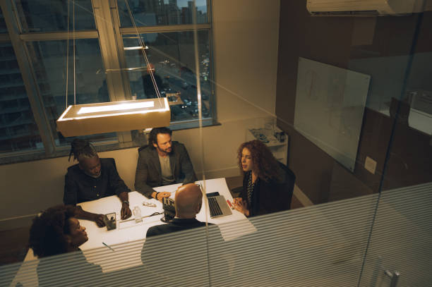 istock Coworkers talking at the table 1444565068