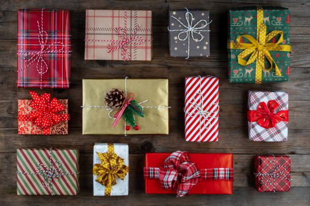 istock Christmas presents on wooden background. 1444566721