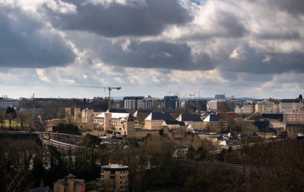 Luxembourg City on a cloudy day in early spring, looking across the Pont Adolphe to the city skyline. This still image is part of a series, a time lapse video is also available.