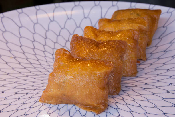 istock Japanese Inari Sushi on a plate close up 1444569161