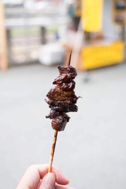 istock Spicy grilled Hida beef skewers, close up 1444569162