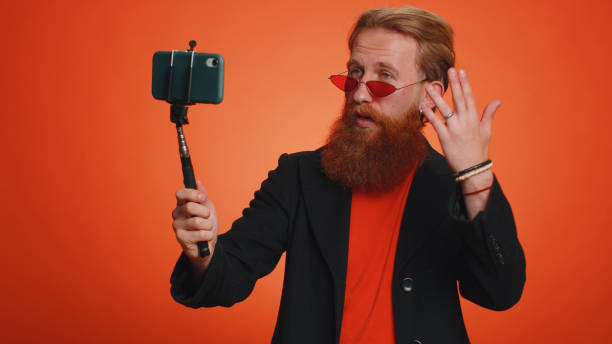 istock Man blogger influencer taking selfie on smartphone, communicating video call online with subscribers 1444569796