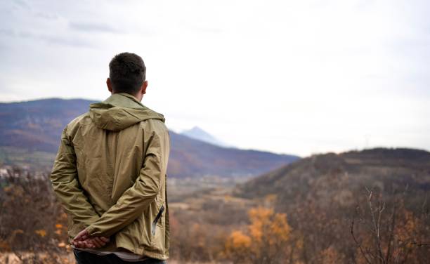 istock Young hiker taking a rest and admires the landscape after a long hike 1444573231