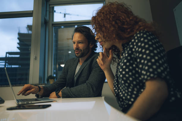 istock Coworkers talking at the conference table 1444574295