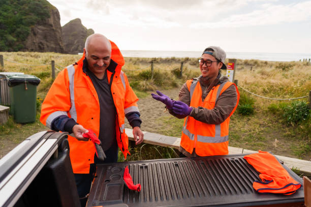 istock Volunteers getting ready to collect plastic on beach. 1444594847