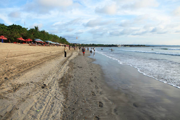 Kuta Beach in Bali, Indonesia in the late afternoon before sunset.