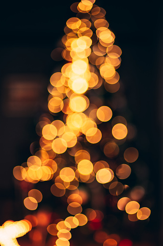 Dreamy Bokeh photo of Christmas Tree lights, Abstract Colorful Tree Background