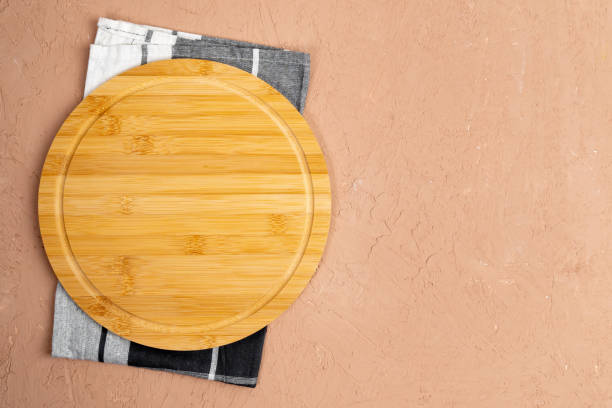 istock Round cutting boards. On a brown background. Top view. Copy space 1444615206