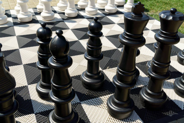 istock Outdoor oversized chess on the ground in public area zone, Selective focus 1444615329