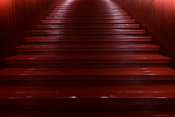 Side view of old wooden stairs with white grip.