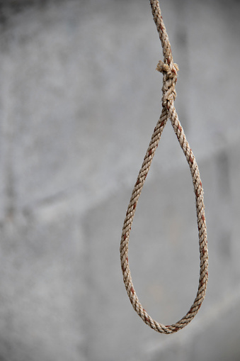 The noose of the rope hanging on the roof symbolizes self-harm.