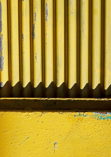istock old yellow shutter detail background 1444626338