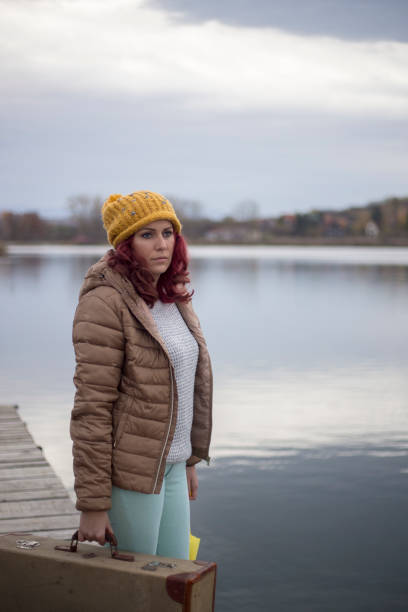 istock female passenger with suitcase on lake 1444634706