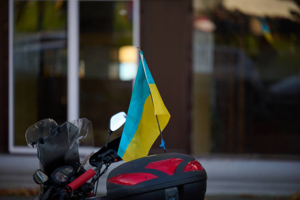 istock Ukrainian yellow-blue flag is attached on a motorcycle 1444665814