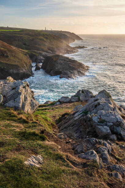istock Stunning sunset landscape image of Cornwall cliff coastline with tin mines in background viewed from Pendeen Lighthouse headland 1444671285