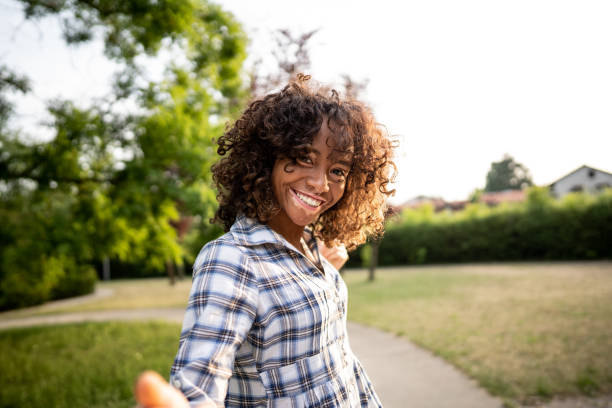 istock Young african woman looking at camera and smiling 1444677350