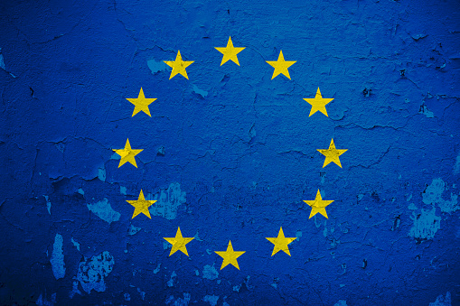 Flag of European Union overlay with grunge  wall background.