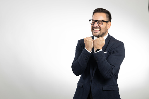 Business man studio portrait on white background, showing confident and happy faces