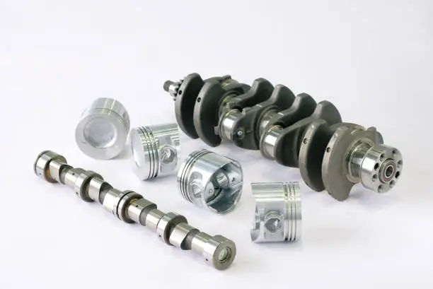 Photo of Crankshaft with sprocket assembly, camshaft and pistons assembly.