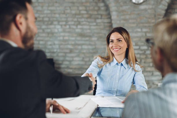 istock Happy business colleagues shaking hands in the office 1444691969