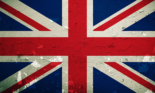 Flag of Britain overlay with grunge  wall background.