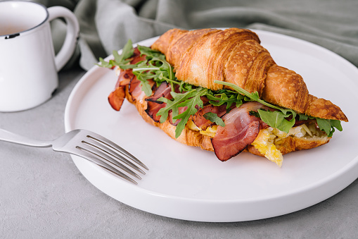 Fresh sandwich with bacon and scrambled eggs