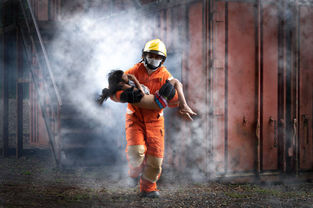 woman on a strethcer after an injury with to paramedic ready to be carried to the hospital