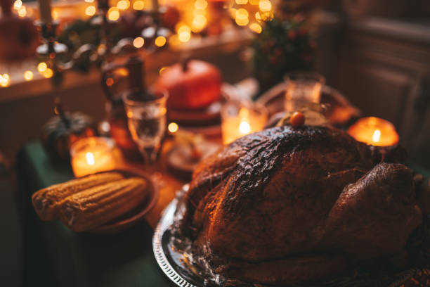 istock Thanksgiving holiday dinner table setting with fall decoration and pumpkins 1444700523