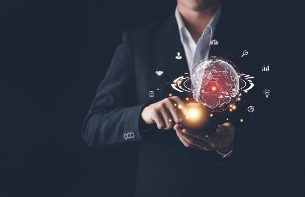 istock Hand of Businessman hold virtual global with hologram using metaverse and internet connection. Business technology link digital marketing. Application on smartphone. Big data and Financial banking. 1444702674