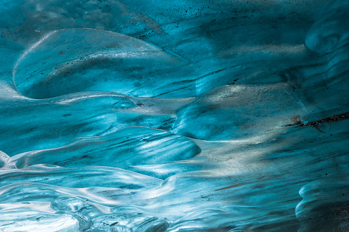 beautiful blue ice wall in an ice cave of the Vatnajökull glacier in Iceland; Höfn, Iceland