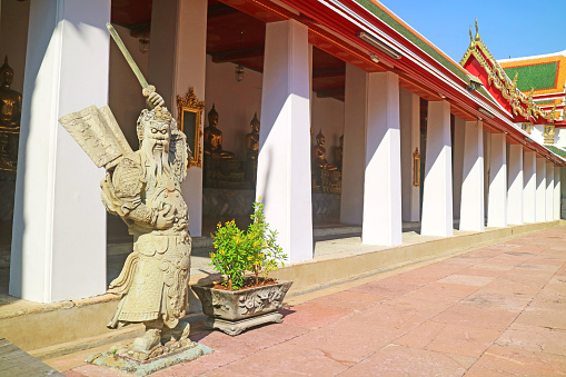 Cloister of Wat Pho Temple with Chinese Guardian Statue Used as Ballast Stones on the Ships Hundred Years Ago, Bangkok, Thailand