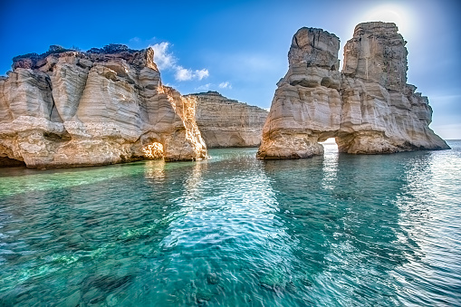 Natural rocky arches with clear transparent waters in Kleftiko, Milos island, Cyclades, Greece
