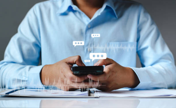 istock Man hand using smartphone typing Live chat chatting and social network concepts, chatting conversation working at home in chat box icons pop up. Social media marketing technology concept. 1444706327