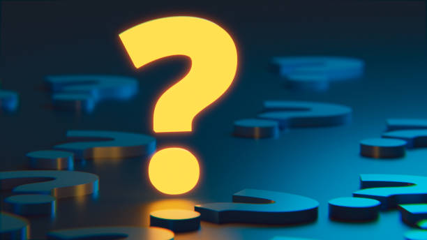 istock Colorful question mark stands on the ground with bright light 1444708256