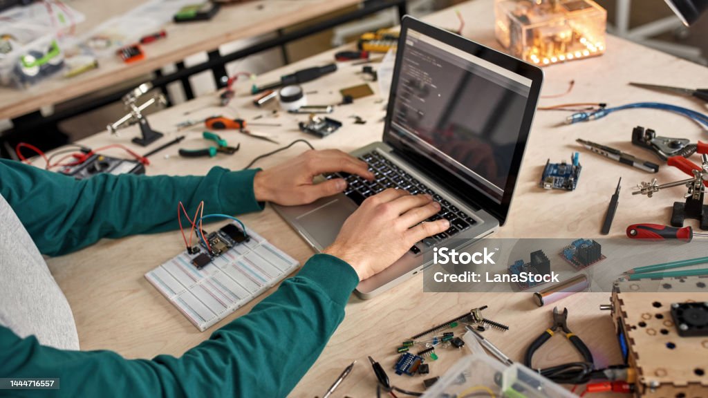 Programmer Programming Code Of Microchip On Laptop Stock Photo ...