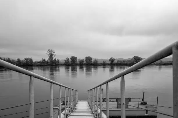 A pier for excursion boats on the Danube in the autumn fog.