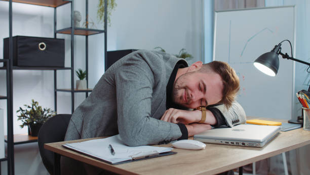 istock Bored sleepy business man worker working on laptop computer, yawning, falling asleep at office 1444721066