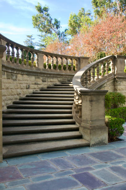 istock Dramatic outdoor curved staircase leading to the courtyard 1444723095