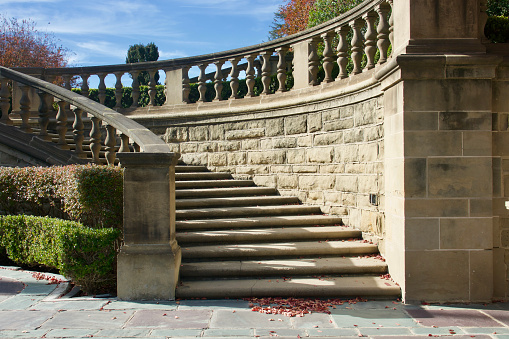 Closeup of grand staircase leading to formal garden