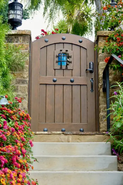 Rustic wood garden gate with look-through speakeasy feature