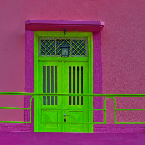 istock Green Door with Pink Background. Isolated. 1444727462