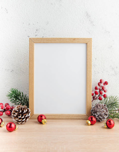 istock White blank wooden frame mockup with Christmas decorations 1444727748
