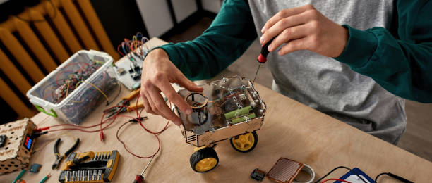 istock Cropped male IT engineer fix automated wheel robot 1444729298