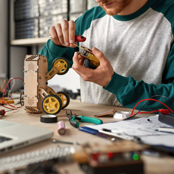 istock Cropped IT technician repair part of wheel robot 1444729657