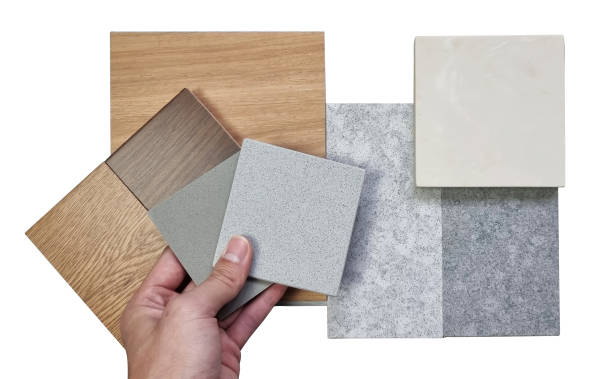 istock interior decorator choosing material samples including grainy quartz, vinyl floor tile, onyx marble tile, laminated floor tile, artificial stones isolated on white background with clipping path. 1444735090
