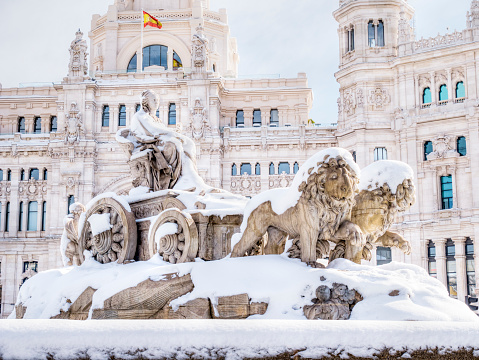 Cibeles fountain and city hall with snow. Madrid. Spain