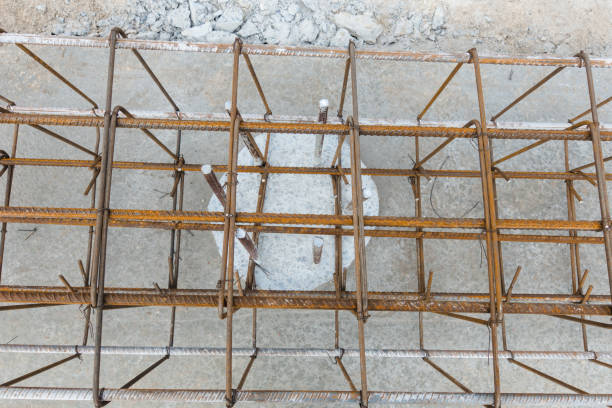 istock Monolithic foundation with metal reinforcement. Reinforcement construction mesh. Concrete pile foundation after completed for new construction site. The construction tool for monolithic works. 1444738326