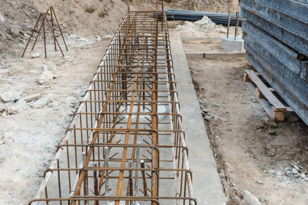 istock Monolithic foundation with metal reinforcement. Reinforcement construction mesh. Concrete pile foundation after completed for new construction site. The construction tool for monolithic works. 1444738327