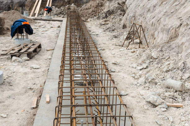 istock Monolithic foundation with metal reinforcement construction mesh. Concrete pile foundation after completed for new construction site. The construction tool for monolithic works. 1444738328